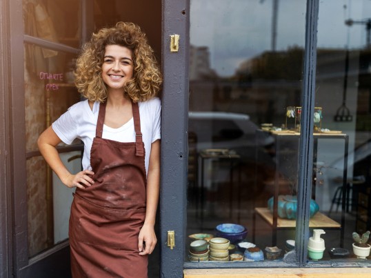 GLS business customer standing in front of her store