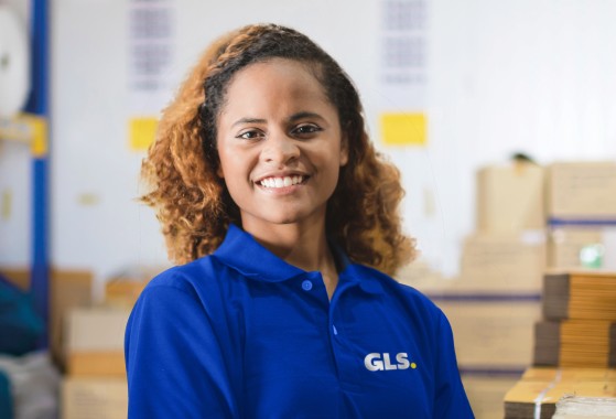GLS worker smiling in warehouse